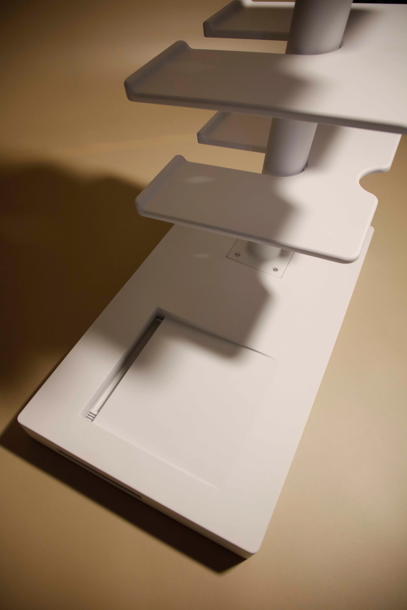 Detail view of ENTRY base showing drainage tray and grounded structural connection.