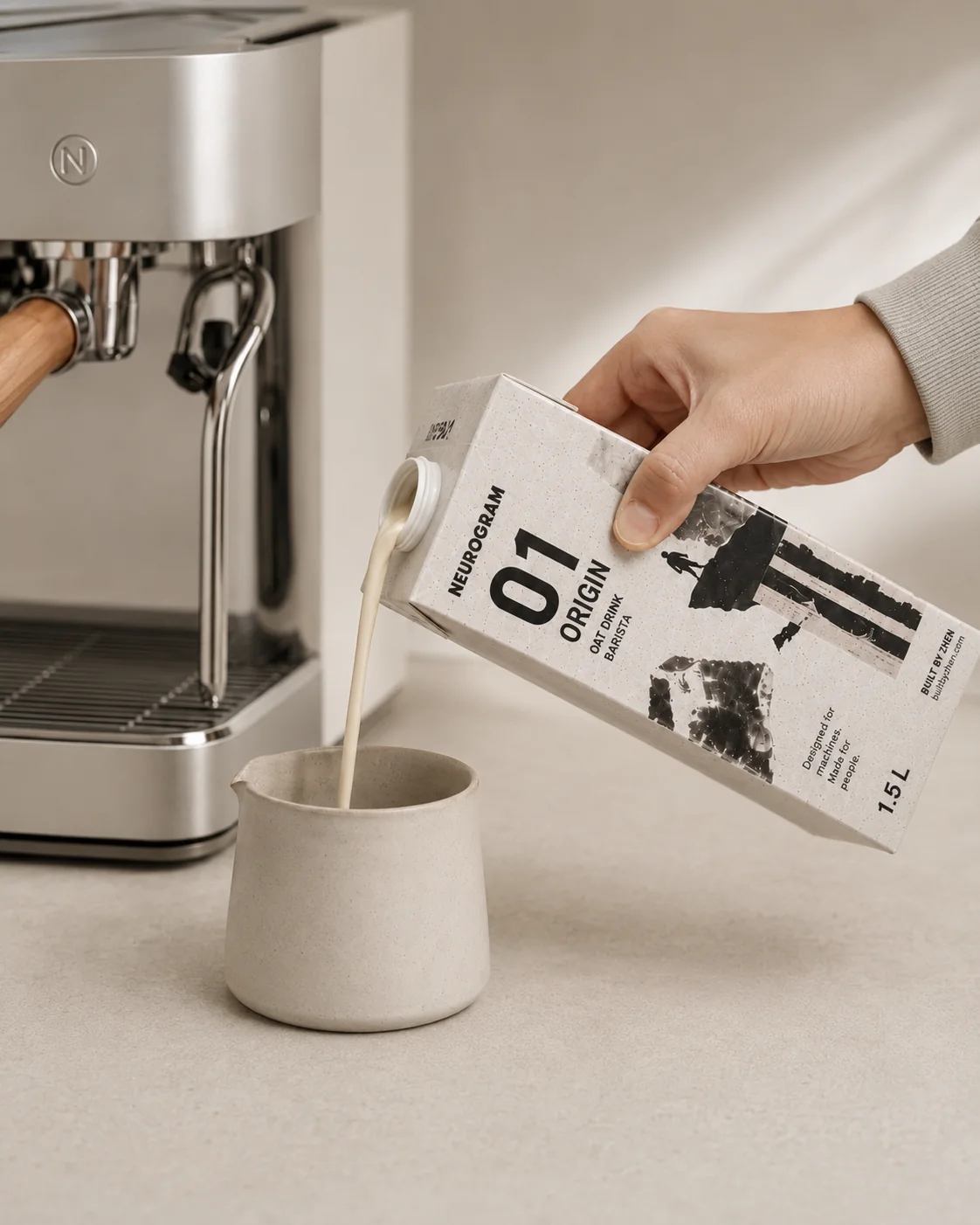 NEUROGRAM ORIGIN oat drink used beside an espresso machine.