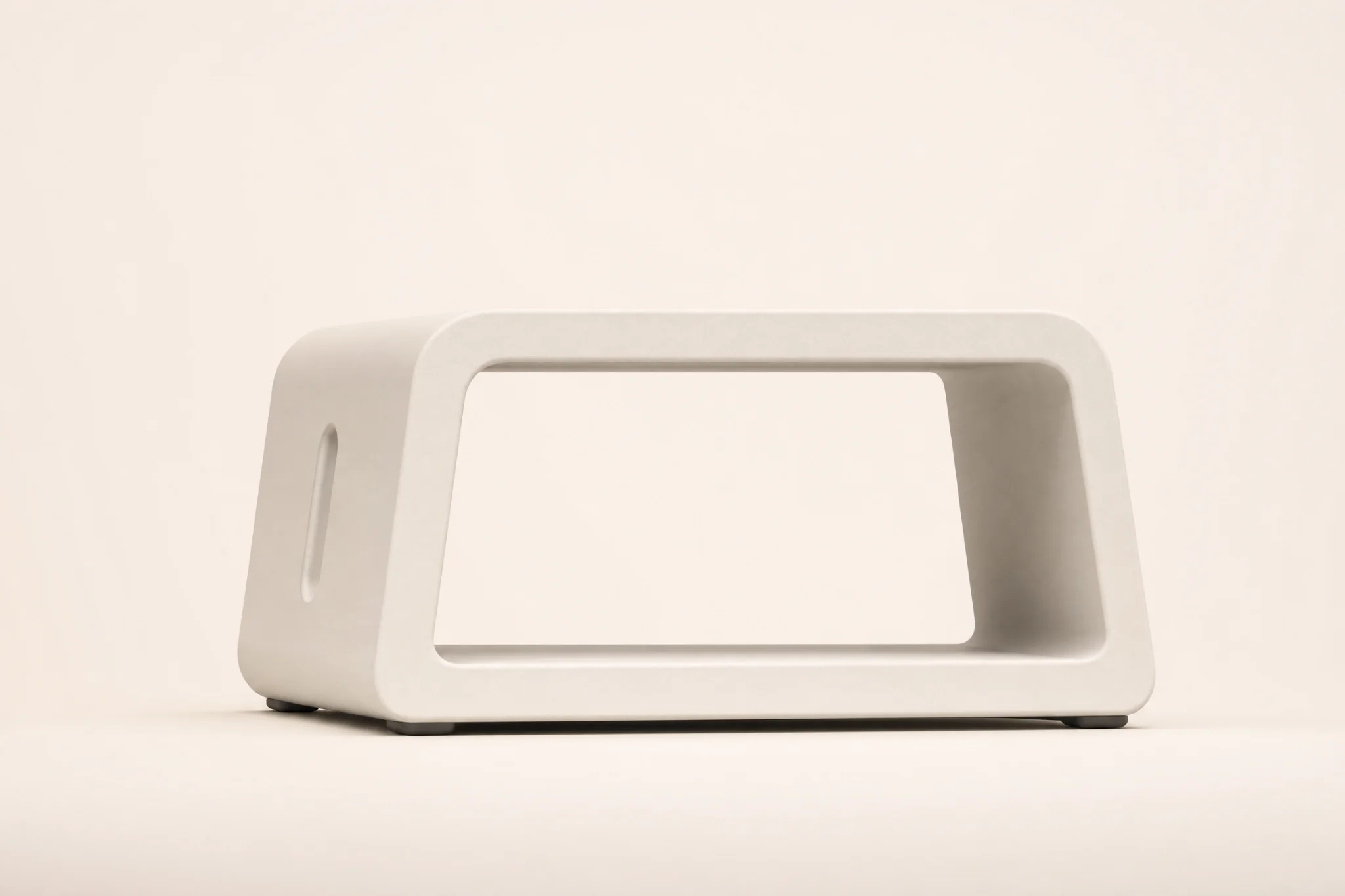 Front studio view of Threshold Chair showing its folded loop profile and hollow opening.